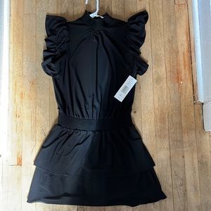 Black Dress with turtle neck, ruffled short sleeves, layered bottom. Cut…